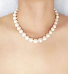 This timeless classic necklace is handmade with Freshwater Pearls knotted into a single strand.  Graduated beads measure 14.5 mm to 12.5 mm.  925 Sterling Silver round ball magnetic clasp.Necklace Length 45 cm (17.7 in)Handcrafted – one of a kind.  Made in Greece.All items are delivered ready for gift-giving. Please don’t hesitate to contact me if you have any questions regarding this item. I’ll be happy to assist you.Thank you for visiting my shop. View additional designs herehttps://www.etsy.c Classic Necklace, Link Necklace, Gold Plated Sterling Silver, Pearl Beads, Fresh Water, Freshwater Pearls, Pearl Necklace, Natural Gemstones, Beaded Necklace