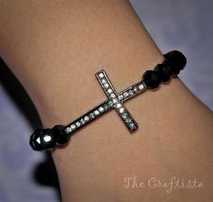 "Beautiful Faith bracelet in an easy to wear strong stretchy cord. Fits all sizes. Simply elegant! Strung within black 8 mm swarovski crystals, the focal point of this piece is a sophisticated slim 24 x 25 mm gunmetal cross that catches light at your every move. Stunning! This bracelet fits a 6\" to 7\" wrist comfortably. If you want another size, style or color, just leave me a message. Measure your wrist if you're not sure about your size. My team and I would be happy to create your dream brac Adjustable Black Crystal Bracelet With Rhinestones, Adjustable Black Crystal Rhinestone Bracelet, Black Crystal Bracelet With Rhinestones As Gift, Black Rhinestone Bracelets As Gift, Black Rhinestone Bracelets For Gifts, Faith Bracelet, Dream Bracelet, Godparent Gifts, Bracelet Couple