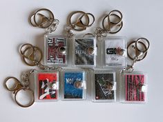 six different key chains with tags attached to them