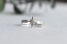 >Starburst with cubic zirconia stone >925 Sterling Silver fully hallmarked. >Sterling silver is an almost pure metal made from 92.5% Silver. >Star at 9.5mm X 9.5mm >Approx 2.5mm band width. FREE SHIPPING USA- All of our jewelry will arrive in custom packaging ready for gift giving. CARE: To prolong the color and shine of your jewelry, avoid contact with perfume, lotion, and water. Store in a bag or jewelry box. SATISFACTION GUARANTEED All pieces are carefully examined prior to del Celestial Silver Diamond Ring With Accents, Celestial Silver Diamond Ring For Anniversary, Silver Star-shaped Diamond Ring Gift, Celestial Style Silver Diamond Ring With Accents, Sterling Silver Star-shaped Diamond Ring For Anniversary, Diamond White Star-shaped Anniversary Rings, Silver Star-shaped Ring With Diamond Accents, Sterling Silver Star-shaped Diamond Ring, Celestial Style Sterling Silver Diamond Ring Gift