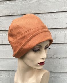 Enhance your summer outfits with this charming Orange Linen Small Brim Cloche Hat. Beautifully handcrafted with attention to detail, this unique accessory boasts a timeless design that will elevate your ensemble. Made from high-quality linen, this hat is breathable and lightweight, making it perfect for those warm sunny days. Effortlessly stylish and versatile, this handmade cloche hat is a must-have addition to your hat collection. Add a pop of color and a touch of elegance to your look with this fabulous accessory. *Size medium to fit head size 57cms/22.4 inches. *May be hand washed as I have pre-washed the linen to prevent shrinkage. Iron with another piece of fabric protecting the hat to prevent shine. To see more of my hats please click https://www.etsy.com/uk/shop/OverToYou I design, Classic Cloche Hat For The Beach, Orange Adjustable Summer Hat, Adjustable Orange Summer Hat, Summer Cloche Sun Hat, One Size Fits Most, Adjustable Summer Cloche Hat, Adjustable Cloche Hat For Vacation, Summer Cloche Hat With Curved Brim, Orange Cotton Beach Hat, Summer Cloche Hat With Wide Brim