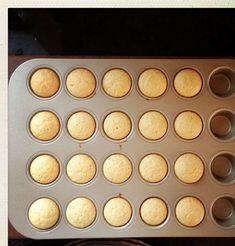 a muffin pan filled with cupcakes sitting on top of a counter