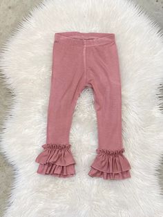 "The listing is for one pair of double ruffle leggings only. Choose color in drop down menu Our ruffle leggings run true to size to slightly generous. Size-inseam of leggings NB-6\" 0-3m-7\" 3-6m-8\" 6-9m- 9\" 9-12m-10.5\" 12-18m-11.5\" 18-24m-13\" 2-3t-14.5\" 3-4t-16\" 4-5y-17.5\" 5-6y-19\" 6-7y-20\" Please note: Due to variation in each computer monitor there may bel slight differences between the photo shown and the actual item." Cute Stretch Bottoms, Cute Stretch Bottoms With Ruffles, Cute Fitted Bottoms With Ruffles, Cute Ruffled Bottoms For Loungewear, Cute Stretch Bottoms For Fall, Cute Ruffled Loungewear Bottoms, Spring Elastic Bottoms With Ruffles, Spring Bottoms With Elastic Ruffles, Spring Bottoms With Ruffles And Elastic Fit