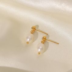 Introducing our Bora Bora earrings, adorned with exquisite freshwater pearls, a harmonious blend of resilience and sophistication. Crafted with precision, these earrings combine the enduring strength of stainless steel with the opulence of gold plating, ensuring they stay radiant through any adventure. The lustrous freshwater pearls, suspended gracefully from the golden hooks, add a touch of timeless elegance to your look. Embrace the versatility and enduring beauty of these earrings, designed t Gold Teardrop Pearl Earrings Tarnish Resistant, Tarnish Resistant Gold Teardrop Pearl Earrings, Tarnish-resistant Pearl Drop Earrings, Gold Minimalist Pearl Earrings Tarnish Resistant, Gold Minimalist Pearl Earrings, Tarnish Resistant, Dainty Gold Pearl Earrings Tarnish Resistant, Gold Minimalist Tarnish-resistant Pearl Earrings, Everyday Gold Earrings With Pearl Pendant, Gold Pearl Earrings Tarnish Resistant