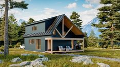 a small blue cabin in the middle of some rocks and trees with mountains in the background