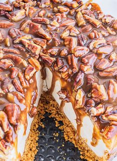 a close up of a cake with nuts on top