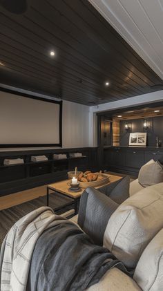 a living room filled with furniture and a flat screen tv mounted to the side of a wall