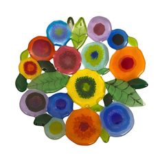 an assortment of colorful glass flowers arranged in a circle