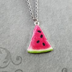 "This listing is for a watermelon slice charm necklace. You'll be able to choose your chain length and style at checkout by using the \"Chain Length/Style\" drop-down menu. Keyrings, bangle bracelets, ball chains, and black/brown leather and suede cord are also available. **Please see the second photo for scale! If you're on the mobile site, just swipe to the side. :) - - - - - - - Sign up for our newsletter to receive coupons and updates on new items! Follow the link: ♦ ♦ ♦ http://eepurl.com/cG Trendy Nickel-free Sterling Silver Charm Necklaces, Cute Nickel-free Pendant Jewelry, Cute Nickel-free Round Necklaces, Cute Nickel-free Metal Charm Necklace, Cute Nickel-free Metal Charm Necklaces, Cute Metal Charm Necklace Nickel Free, Trendy Nickel-free Dangle Charm Necklaces, Watermelon Colored Summer Jewelry Gift, Summer Watermelon Colored Jewelry For Gift