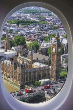 an aerial view of big ben and the houses of parliament in london, england taken from a plane window