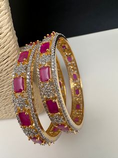 Traditional Bangles comes in set of 4Color : GoldSize : Size : 2.4Stones : AD Red Stones Red Hand Set Bangle For Party, Trendy Red Jewelry For Festive Occasions, Trendy Red Festive Jewelry, Trendy Red Bangle Jewelry, Traditional Bangles, Red Bangles, Red Stones, American Diamond, Red Stone