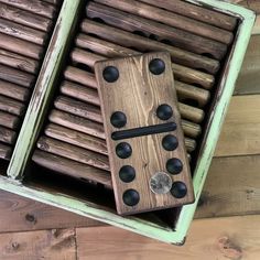 a wooden box filled with lots of buttons