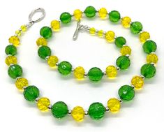 "Delicious Lightweight handcrafted 22\" necklace punches up any outfit.  Acrylic beadwork accents your wardrobe with creativity and color. This sparkly lemon-lime  light-hearted necklace is both classic and contemporary. A breath of spring any time of the year!  Refresh that outfit and make it new again!" Party Green Necklaces With Lobster Clasp, Green Necklaces With Lobster Clasp For Party, Summer Party Jewelry With Faceted Beads, Green Beaded Necklaces With Large Beads For Summer, Handmade Yellow Beaded Necklaces For Spring, Green Spring Party Jewelry, Adjustable Yellow Single Strand Beaded Necklaces, Adjustable Single Strand Yellow Beaded Necklaces, Adjustable Yellow Single Strand Beaded Necklace