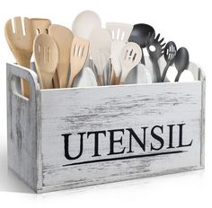 utensils in a wooden box with the word utensil written on it