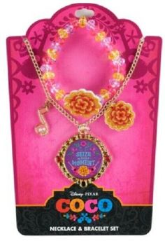 the disney princess necklace and bracelet set is packaged in a pink package with an orange flower