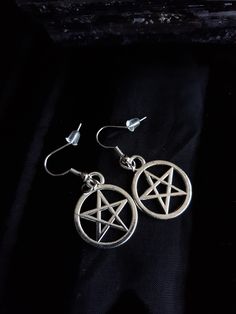 Pentacle dangle earrings (Medium size 1.75 inches X .75) Hypoallergenic Stainless steel ear wire. Pentacle charm is made from Zinc Alloy metal that is lead and nickel free. Care instructions: - Do not bend, untwist, drop or attempt to remove stones. Always handle with care as this is a handmade item. - Store jewelry separately from other products in a clean, cool, dry place. - It is desirable to wrap each product separately in a soft cloth or placed in a tightly closed bag-this will reduce the a Mystical Metal Earrings For Festivals, Symbolic Dangle Earrings For Festivals, Symbolic Metal Dangle Earrings, Gothic Hypoallergenic Drop Earrings, Adjustable Gothic Earrings, Symbolic Dangle Plug Earrings For Pierced Ears, Adjustable Gothic Earrings For Gift, Symbolic Metal Drop Earrings, Adjustable Gothic Style Earrings For Gift