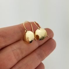 "Made from solid 14 karat gold, these lightweight earrings are hammered and then slightly domed for an elegant appearance perfect for daily wear. Metal: Solid 14k Yellow Gold Disc Diameter: Choose from 3/8\", 1/2\" (pictured), or 5/8\" Matching Necklace can be found here: https://www.etsy.com/listing/772633456/ Packaged for gifting! Each piece of jewelry in my shop is individually handcrafted by me in my studio. If you have any questions, please send me a convo by hitting the 'Ask a question' li Anniversary Hammered Yellow Gold Earrings, Elegant Hammered Everyday Earrings, Hammered 14k Gold Earrings For Gift, Hammered Teardrop Earrings For Anniversary, Hand Forged 14k Gold Round Earrings, 14k Gold Hand Forged Drop Earrings, Oval Hammered Earrings For Anniversary, Hammered Teardrop Earrings For Formal Occasions, Hammered Yellow Gold Earrings Made Of Recycled Gold