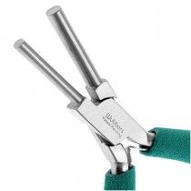 there is a pair of pliers that are on the green cloth with two handles