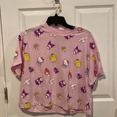 Bnwt Hello Kitty & Friends Cropped T-Shirt Women's Size Large Fast Next Day Shipping Smoke And Pet Free Casual Purple T-shirt With Cartoon Print, Y2k Purple Graphic Print Top, 90s Short Sleeve Tops With Character Print, Kawaii Short Sleeve Tops With Cartoon Print, Purple Y2k Crew Neck Top, Kawaii Short Sleeve Cartoon Print Tops, Kawaii Hello Kitty Print Crew Neck Top, Pink Short Sleeve Top With Hello Kitty Print, Trendy Short Sleeve Tops With Hello Kitty Print