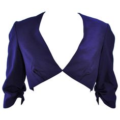 This Elizabeth Mason Couture jacket is composed of a fine purple silk and features a center front hook & eye closure with a darted design. Made in Beverly Hills. Measurements of sample size: Length: 12.75" Sleeve: 15" Shoulder to shoulder: 15.25" Bust: 28" Chic Fitted Silk Blazer, Fitted Silk Outerwear For Wedding, Fitted Silk Evening Blazer, Chic Fitted Silk Outerwear, Fitted Silk Outerwear For Party, Fitted Silk Outerwear For Evening, Silk Fitted Party Outerwear, Fitted Silk Party Outerwear, Fitted Purple Outerwear For Party