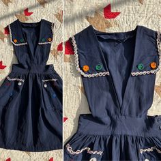 "Unique and rare 1940s navy blue pinafore dress with felt flowers attached. Some are attached with a safety pin rather than sewn on (pictured above). Flowers are red, white, blue, orange, and green. Has a deep V and a collar. So cute and layering options are endless! Great side buttons. Feels like a rayon fabric but not positive.  Condition: overall great vintage condition. When hand-washed, the color slightly bled onto the white trim along the collar and pockets. There is slight color bleed in Navy Vintage Dresses With Buttons, Navy Vintage Dress With Buttons, Blue Pinafore Dress, Pinafore Skirt, Dog Bones, 40s Fashion, Fashion Project, Dreamy Dress, Orange And Green