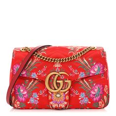 This is an authentic GUCCI Jacquard Matelasse Floral Medium GG Marmont Shoulder Bag in Red. This lovely bag is crafted of a bright red chevron quilted fabric with exquisite floral embroidery. It features an aged gold chain shoulder strap with a leather shoulder pad and an aged gold Gucci GG closure. The front flap opens to a smooth pink satin interior with zipper and patch pockets. Designer Gucci Quilted Bags, Gucci Red Shoulder Bag For Travel, Red Quilted Travel Shoulder Bag, Red Quilted Travel Bag, Red Quilted Shoulder Bag For Travel, Designer Red Embroidered Bag, Red Quilted Rectangular Shoulder Bag, Gucci Tweed, Gucci Marmont Bag