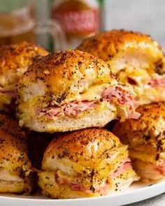 ham and cheese stuffed biscuits on a white plate