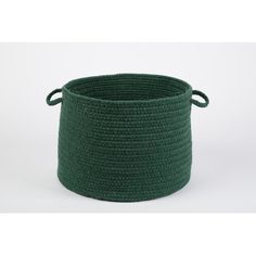 a green crocheted basket with handles on the top and bottom, sitting in front of a white background