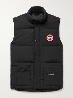 Canada Goose updates its popular 'Freestyle' gilet with a slimmer cut in this 'Crew' version. Designed for lightweight warmth, it's made from durable, water and wind-resistant Arctic Tech and quilted to keep the insulating down fill evenly distributed around your core. The stand collar is lined in soft microfibre for comfort, while six front pockets and two inside provide plenty of storage. Canada Goose Mens, Sleeveless Coat, Outdoor Jacket, Loungewear Shorts, Warm Coat, Classic Sneakers, Mr Porter, Canada Goose, Canada Goose Jackets