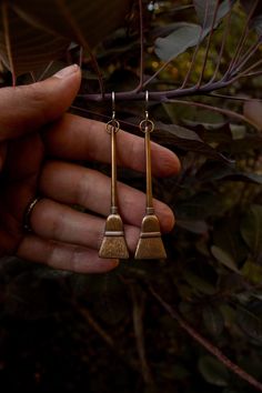 These highly detailed broom earrings are created from solid raw brass with a solid sterling ear hooks. They are lightweight, yet a fun, noticeable size. 🧹To many, brooms symbolize clearing away negative energy or sweeping away what we need to clear out. They can serve as amulets of protection, a cleansing talisman or just a fun earring to wear. 🧹 Each earring weighs .12oz (3.4g) ✦ C A R E - I N S T R U C T I O N S ✦ Each creation is lovingly hand crafted with meticulous attention to detail, ae Broom Earrings, Jewelry Earings, Witchy Earrings, How To Polish Copper, Jewelry Halloween, Earrings Halloween, Witchy Fashion, Witch Jewelry, Gem Earrings