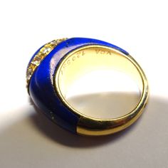 Van Cleef & Arpels 1960s Yellow Gold Lapis Diamond Ring Vintage Blue Lapis Lazuli Ring, Luxury Lapis Lazuli Rings, Vintage Lapis Lazuli Round Jewelry, Vintage Blue Enamel Rings, Vintage Formal Enamel Ring With Polished Finish, Vintage Enamel Ring With Polished Finish For Formal Occasions, Vintage Blue Enamel Ring For Formal Occasions, Vintage Oval Lapis Lazuli Jewelry, Vintage Lapis Lazuli Oval Jewelry