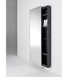 an empty bathroom cabinet is shown with its door open and the mirror on the wall above it