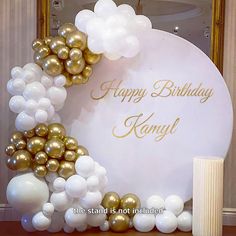 a white and gold birthday sign with balloons