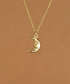 Smiling moon necklace, happy moon pendant, celestial necklace, happy necklace, a gold moon charm on a gold vermeil chain A happy little gold vermeil crescent moon dangles from a 14k gold vermeil chain in the length of your choice! This happy little moon measures 12mmx8mm More from BubuRuby? https://www.etsy.com/shop/BubuRuby?ref=seller-platform-mcnav Looking for other charm necklaces? https://www.etsy.com/shop/BubuRuby?section_id=12318467 More from Bubu Ruby? https://www.etsy.com/shop/BubuRuby?r Dainty Yellow Gold Moon Charm Necklace, Minimalist 14k Gold Moon Charm Necklace, Dainty Yellow Gold Crescent Charm Necklaces, Dainty Crescent Yellow Gold Charm Necklaces, Minimalist Yellow Gold Moon Phase Charm Necklace, Minimalist Yellow Gold Charm Necklace With Moon Phase, Dainty 14k Gold-filled Necklace With Moon Charm, Dainty 14k Gold Filled Crescent Necklaces, Gold Charm Necklace With Moon Phase