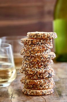 crackers stacked on top of each other with wine in the background