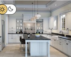 a large kitchen with white cabinets and black counter tops is featured in this image, there are two pendant lights hanging from the ceiling