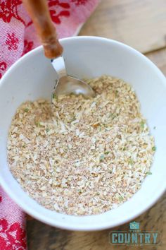 a white bowl filled with oatmeal on top of a wooden table