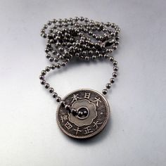 antique JAPANESE COIN JEWELRY necklace. pendant. sen. flower oriental. chrysanthemum. mens necklace . chain No.001124 by PartsForYou on Etsy https://www.etsy.com/listing/124369742/antique-japanese-coin-jewelry-necklace Antique Medallion Jewelry For Good Luck, Vintage Coin Pendant Jewelry For Good Luck, Antique Engraved Jewelry For Good Luck, Vintage Good Luck Coin Pendant Jewelry, Antique Engraved Necklace For Good Luck, Antique Engraved Good Luck Necklace, Vintage Engraved Jewelry For Good Luck, Vintage Brass Jewelry For Good Luck, Vintage Pendant Necklaces For Good Luck