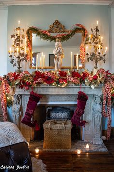 a fireplace decorated with stockings and candles