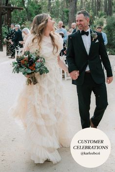 a bride and groom walking down the aisle