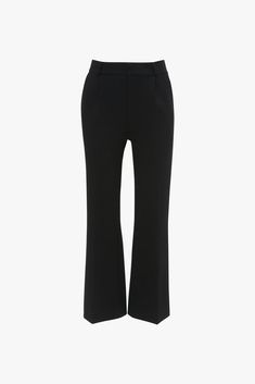 Immaculately tailored trousers are part of the Victoria Beckham brand DNA. Designed to reveal a flattering hint of ankle, these smart trousers have a contemporary kick hem for a more feminine take on the classic black pant. Front and back leg creases have a leg-lengthening effect, while discrete side pockets and welt pockets at the back reinforce the minimalist aesthetic. Styled with the Twist Detail Jersey Top, Frame Belt, Classic Mule, Frame Stud Earrings and the Mini Chain Pouch With Long Strap Victoria Beckham Cropped Kick Trouser In Black  - Size 8 UK Size 12 Uk, Smart Trousers, Minimalist Aesthetic, Jersey Top, Tailored Trousers, Victoria Beckham, Welt Pockets, Welt Pocket, Classic Black