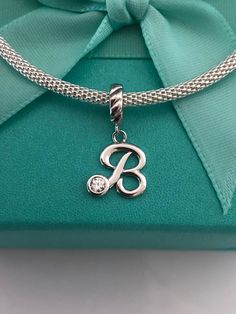 Sterling Silver 925 Letter B charm For a Bracelet  Will Fit all major brands bracelets, any 4mm snake, bangle or chain  It will not rust or change color  Will come in a Box or a Pouch(one per Package). Let us know if you have specific request please. Gift Box available for $4 extra  Ships within 1-2 business days from Los Angeles CA USA Snake Bracelet, Pandora Bracelet Charms, A Bracelet, Letter B, Butterfly Charm, Cz Diamond, Pandora Bracelet, Photo Bracelet, 925 Jewelry