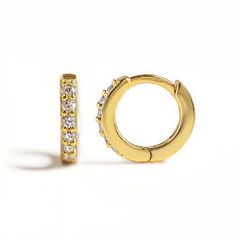 Minimal Gold huggie hoop earrings that hug your ear perfectly. Pave crystals give an extra sparkle to a classic shape. Perfect to wear alone or paired with other dainty earrings. Gold Vermeil Cubic Zirconia pave crystals Hypoallergenic, lead and nickel free Width: 1.5mm Inside Diameter: 5.5mm, 6.5mm, 7.5mm, 8.5mm, 9.5mm Click close mechanism #E531-G Small Hoop Cubic Zirconia Crystal Earrings, Anniversary Huggie Earrings With Sparkling Stones, Small Hoop Cubic Zirconia Huggie Earrings, Sparkling Huggie Earrings Gift, Small Hoop Huggie Earrings With Sparkling Stones For Gift, Sparkling Cubic Zirconia Huggie Earrings, Cubic Zirconia Huggie Earrings With Sparkling Stones, Everyday Huggie Earrings With Sparkling Stones, Gold Sparkling Huggie Earrings