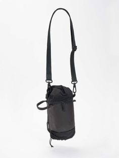 This wearable pouch is designed to be worn both vertically and horizontally. A playful twist in the material at the ends of the bag hide the various carrying loops. A central compartment offers optimal storage options for your everyday carrying needs while the side pocket can be used to store a small drink bottle. The MINI DUFFLE comes with a carry strap but can also be directly clipped onto a bigger bag or be worn in combination with an ADDA. Versatile Bags With Water Bottle Pocket For Outdoor Activities, Versatile Bag With Water Bottle Pocket For Outdoor Activities, Versatile Bags For Outdoor Activities With Water Bottle Pocket, Outdoor Activities Bag With Water Bottle Pocket, Modern Mobile Phone Bag For Outdoor Activities, Functional Shoulder Bag With Water Bottle Pocket, Functional Bags With Water Bottle Pocket For On-the-go, Practical Shoulder Bag With Water Bottle Pocket, Functional Black Shoulder Bag With Water Bottle Pocket