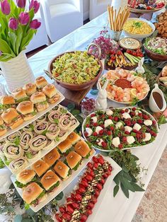 a buffet table filled with lots of food