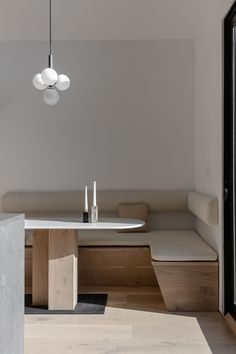 a white table and bench in a room