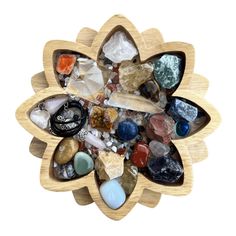 a wooden brooch with many different stones in it