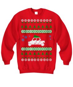 a red christmas sweater with a white car and trees on the front, all in green