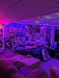 a living room filled with lots of furniture and lights on the wall above it's tv