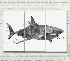 three black and white shark paintings on a brick wall